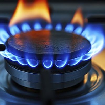 The blue flame of a gas stove.